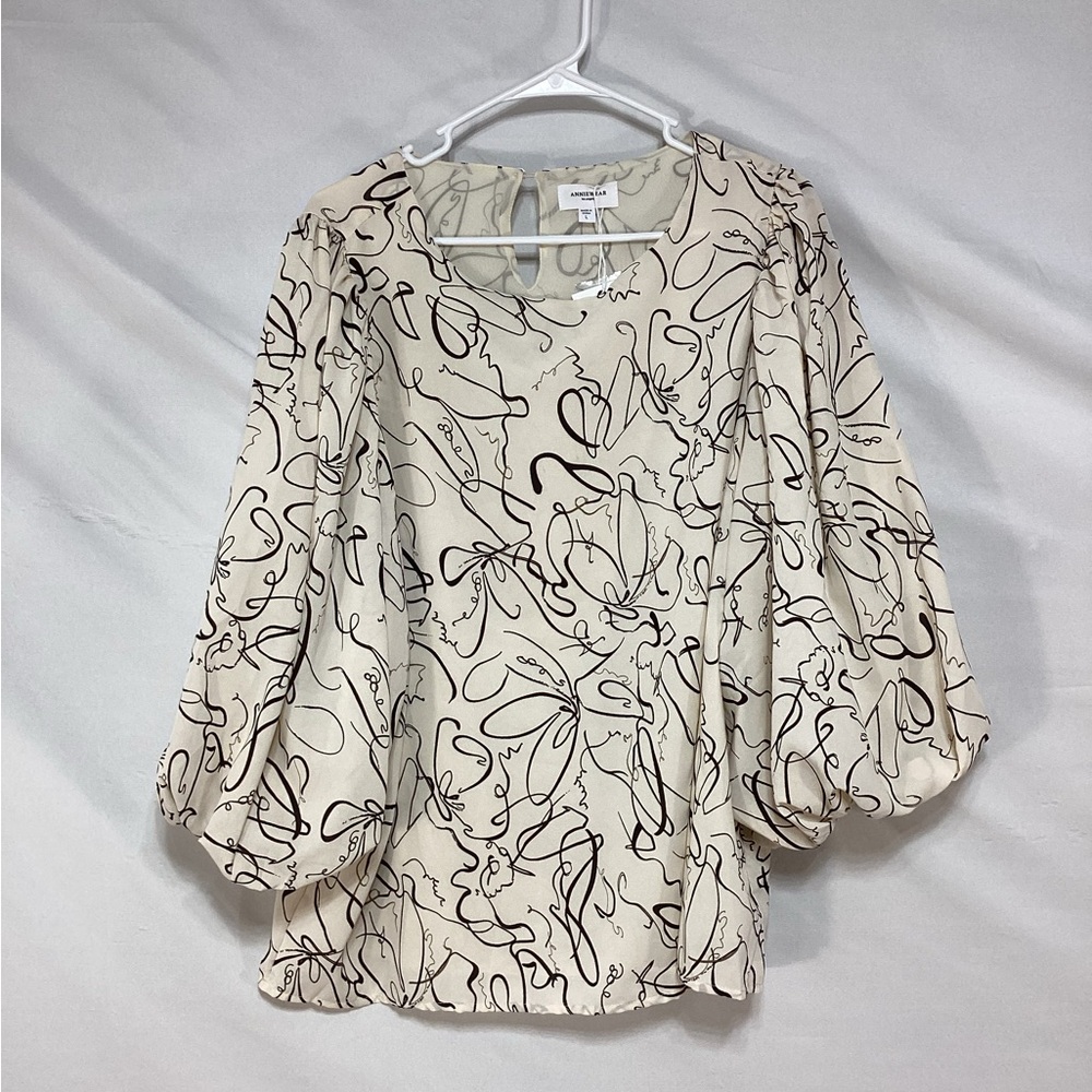 Elegant Cream Blouse with Black Abstract Design